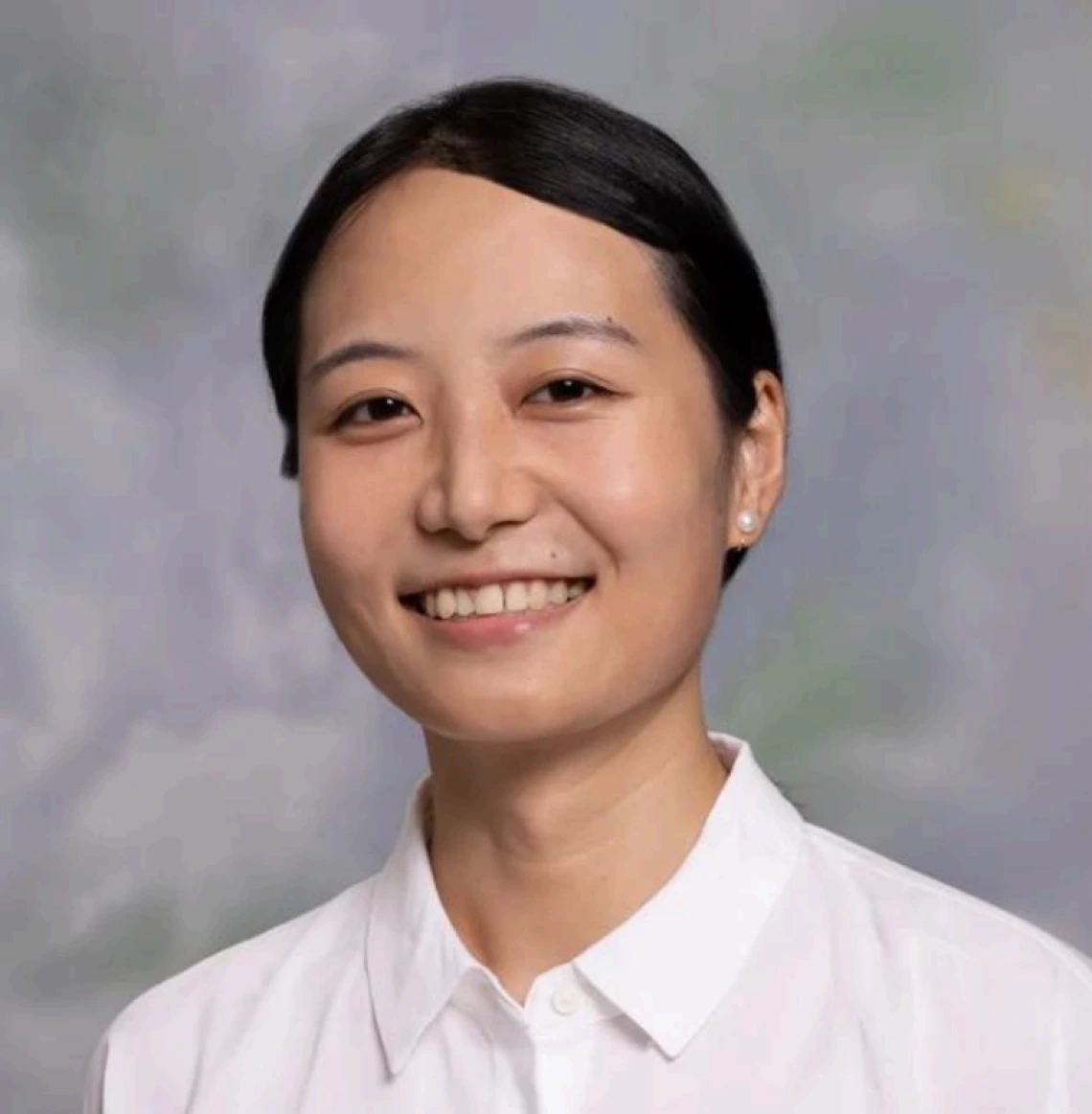 Professional photo of Xiao Ding wearing a button up white shirt